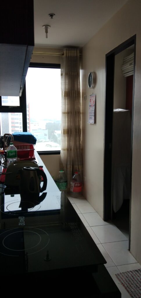 Well ventilated with natural light kitchen with opening to laundry area