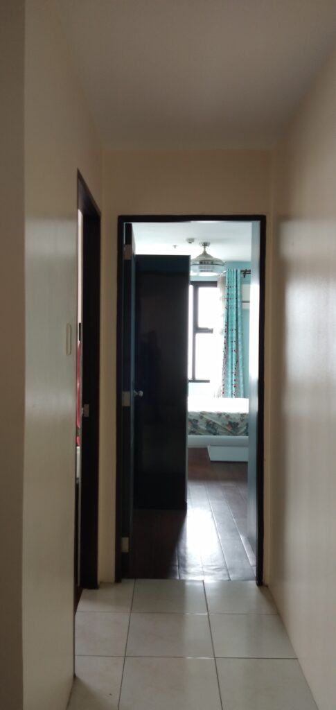 Small corridor leading to Master's Bedroom with balcony and Bedroom 2